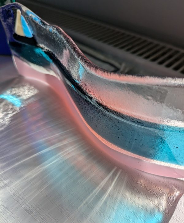Atlantic Beach glass art featuring pink sand, ocean and boat.